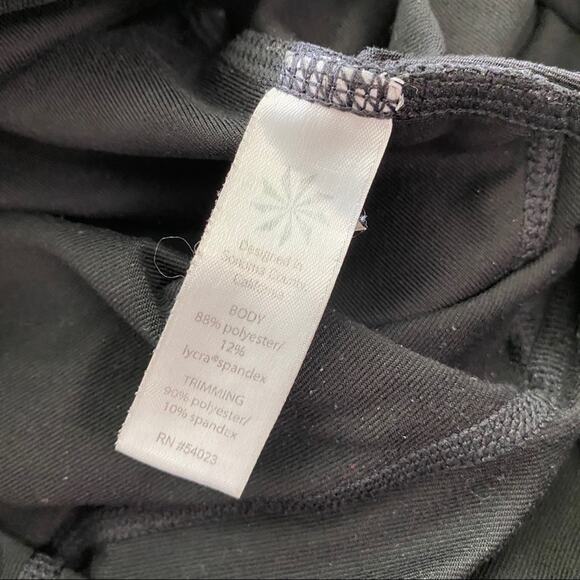 Athleta Be Free Knicker EUC Black XS White Reflectors Capri Side Stash Pocket - Picture 6 of 10